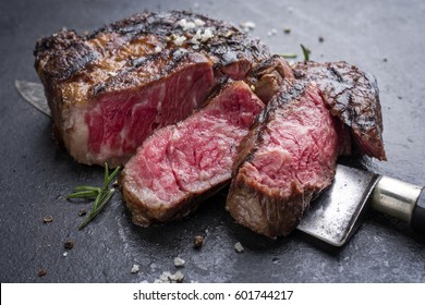 Barbecue aged Wagyu Rib Eye Steak as close-up on slate 