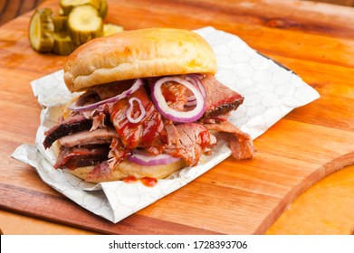 Barbecue Beef Brisket Sandwich Or Bbq Catering Platter Of Meats. Traditional Texas BBQ: Beef Brisket, Beef Ribs, Pork Ribs, Sausage Links,  Pepper Roasted Chicken, & Turkey Served With Homemade Sauce.