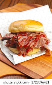 Barbecue Beef Brisket Sandwich Or Bbq Catering Platter Of Meats. Traditional Texas BBQ: Beef Brisket, Beef Ribs, Pork Ribs, Sausage Links, Pepper Roasted Chicken, & Turkey Served With Homemade Sauce.