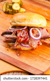 Barbecue Beef Brisket Sandwich Or Bbq Catering Platter Of Meats. Traditional Texas BBQ: Beef Brisket, Beef & Pork Ribs, Sausage Links,  Pepper Roasted Chicken, And Turkey Served With Homemade Sauce.