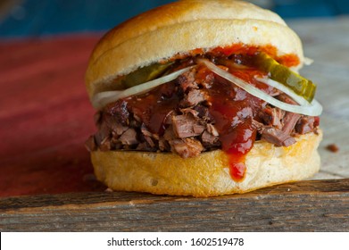 Barbecue Beef Brisket Sandwiches. BBQ Traditional Texas Barbecue Sandwiches. Pulled Pork. Thick Sliced Smoked Beef Brisket. Chopped Beef Brisket With Barbecue Sauce Bbq Sauce. Served On White Buns.