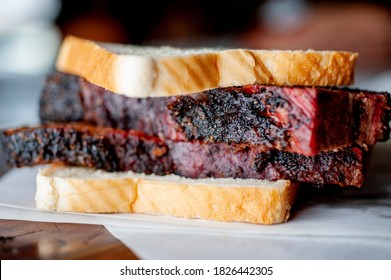 Barbecue Beef Brisket Sandwiches. BBQ Traditional Texas Barbecue Sandwiches. Pulled Pork. Thick Sliced Smoked Beef Brisket. Chopped Beef Brisket With Barbecue Sauce Bbq Sauce. Served On White Buns.