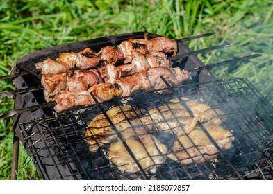 Barbecue And Chicken Breasts Grilling Outdoors On A Grill Good Mood For A Picnic On A Sunny Day No People.