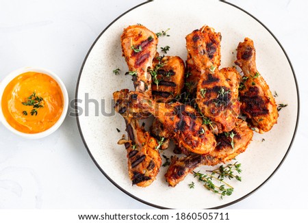 Barbecue Chicken Drumsticks-Grilled Chicken Legs with Condiment, Garnished with Fresh Thyme, Top Down Food Photo Stock fotó © 
