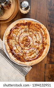 Barbecue Chicken Pizza With Sauce, Mozzarella Cheese, Fresh Red Onions And A Sauce Swirl Served In A Portland, Oregon Restaurant.