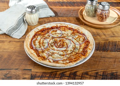 Barbecue Chicken Pizza With Sauce, Mozzarella Cheese, Fresh Red Onions And A Sauce Swirl Served In A Portland, Oregon Restaurant.