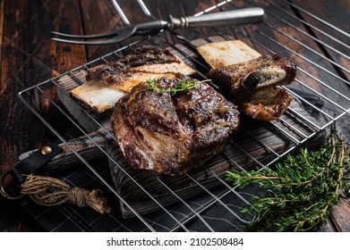 Barbecue Chuck Beef Short Ribs On Grill. Wooden Background. Top View