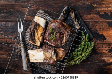 Barbecue Chuck Beef Short Ribs On Grill. Wooden Background. Top View.