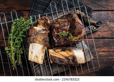 Barbecue Chuck Beef Short Ribs On Grill. Wooden Background. Top View.