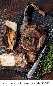 Barbecue Chuck Beef Short Ribs On Grill. Wooden Background. Top View.