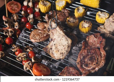 Barbecue with delicious grilled meat on the gril top view