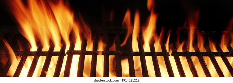 Barbecue Fire Grill Isolated On Black Background. BBQ Flaming Charcoal Grill Isolated. Hot Barbeque Charcoal Cast Iron Grill With Bright Flames Of Fire. Abstract Panoramic Grill Wide Banner.