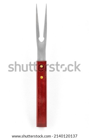 Barbecue fork isolated on white background. Stainless steel grill fork with wooden handle. Close-up