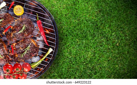 Barbecue garden grill with beef steaks, close-up. - Shutterstock ID 649223122
