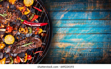 Barbecue garden grill with beef steaks, close-up. - Shutterstock ID 649224193