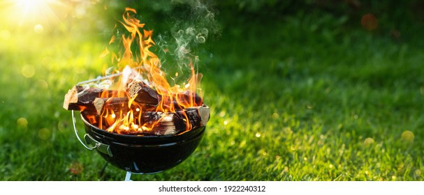 Barbecue Grill with Fire on Open Air. Fire Flame