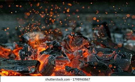 Barbecue Grill Pit With Glowing And Flaming Hot Charcoal Briquettes, Close-Up