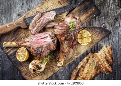 Barbecue Lamb Knuckles on old Cutting Board
