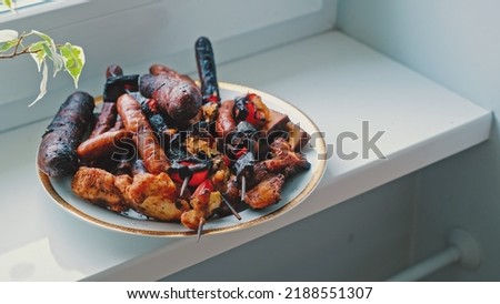 Barbecue Party Leftovers Grilled and Burnt Sausages Skewers and Meat