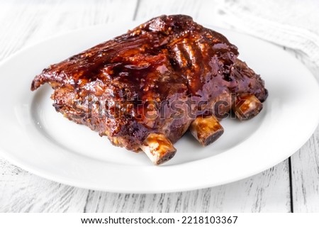 Barbecue pork spare ribs on the white plate