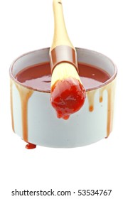 Barbecue Sauce And Basting Brush Isolated On White.