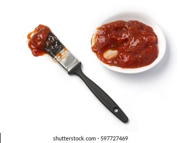 Barbecue Sauce And Basting Brush Isolated On White.