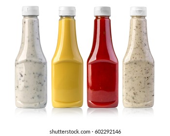 barbecue sauces in glass bottles on white background 