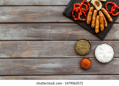 Barbecue, Sausages, Vegetables And Kitchen Tools On Wooden Background Top View Mock Up