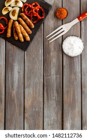 Barbecue, Sausages, Vegetables And Kitchen Tools On Wooden Background Top View Mock Up