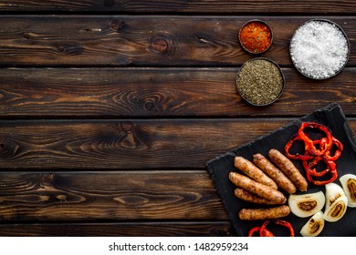 Barbecue, Sausages, Vegetables And Kitchen Tools On Wooden Background Top View Mock Up