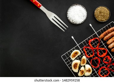 Barbecue, Sausages, Vegetables On Black Background Top View Mock Up