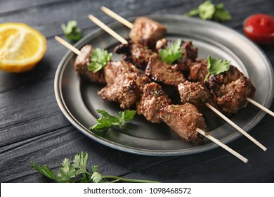 Barbecue Skewers With Juicy Meat On Metal Plate