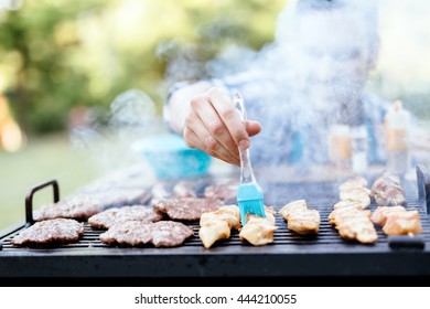 Barbecue spices and seasonings being added to meat