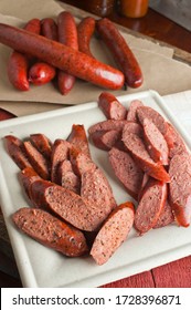 Barbecue Spicy Pork Sausages Or Bbq Catering Platter Of Meats. Traditional Texas BBQ: Beef Brisket, Beef Ribs, Pork Ribs, Sausage Links,  Pepper Roasted Chicken, And Turkey Served With Homemade Sauce.