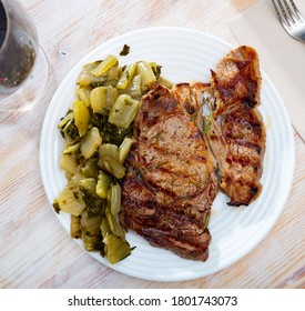 Barbecue Veal Steak Served With Marinated Chopped Chard Leaves