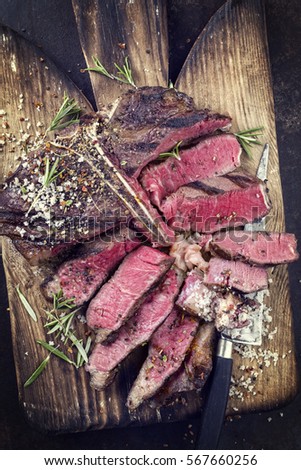 Barbecue Wagyu T-Bone Steak on old Cutting Board
