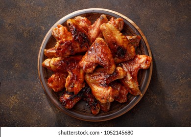 Barbecued Chicken Wings In The Bbq Sauce On The Plate. Step By Step Recipe Of Homemade Bbq Wings Top View.