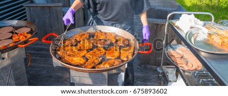 Barbecuing in sunlight in summer