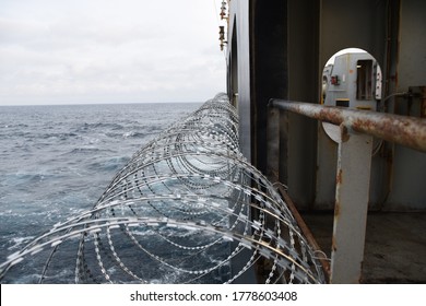 Barbed Wire Attached To The Ship Hull, Superstructure And Railings To Protect The Crew Against Piracy Attack In The Gulf Of Guinea In West Africa.