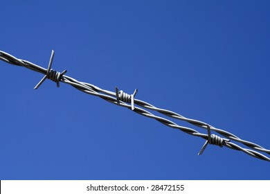 Barbed wire with a blue sky background