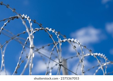 Barbed wire close-up. Metal barbed wire. Border with barbed wire. - Powered by Shutterstock