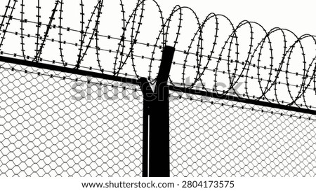 barbed wire of the correctional facility on the background of a gloomy cloudy