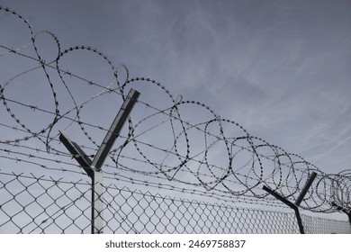 Barbed wire with dramatic background