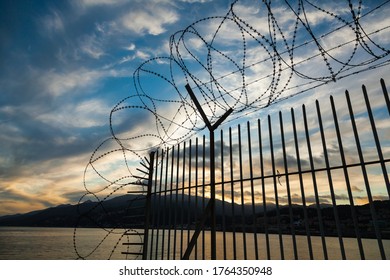 Barbed Wire Fence Enclosing A Closed Area.