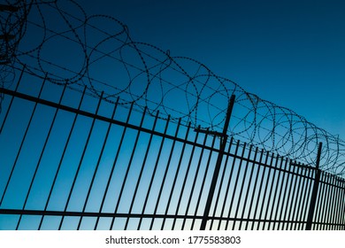 Barbed Wire Fence Enclosing A Closed Area.