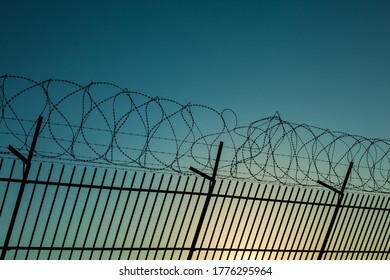 Barbed Wire Fence Enclosing A Closed Area.