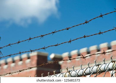 Barbed wire and fence on castle and sky background
