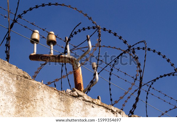 
Barbed wire fence. Fence with protection by
electricity. Security. Border.
Protection.