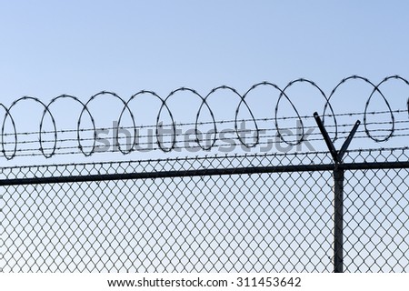 Barbed wire fence of restricted area, boundary