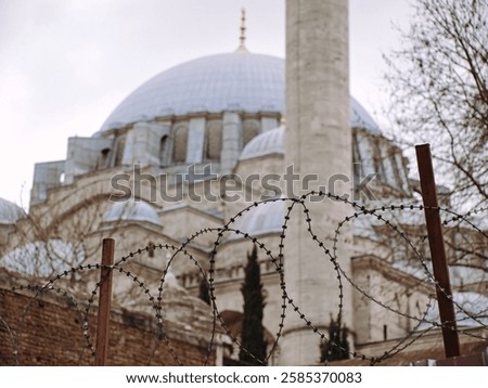 Barbed wire in front of historic mosque